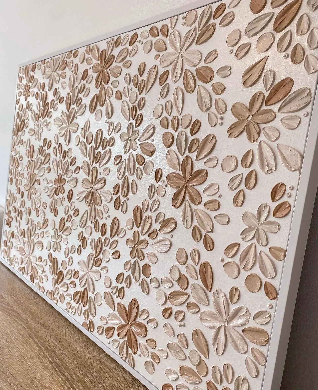 Decorative wall panel with floral pattern on a white background